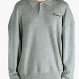 Grey knitwear worn by a person, showing the knitwear's fit