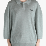 Grey shirt worn by a person, showing the shirt's fit