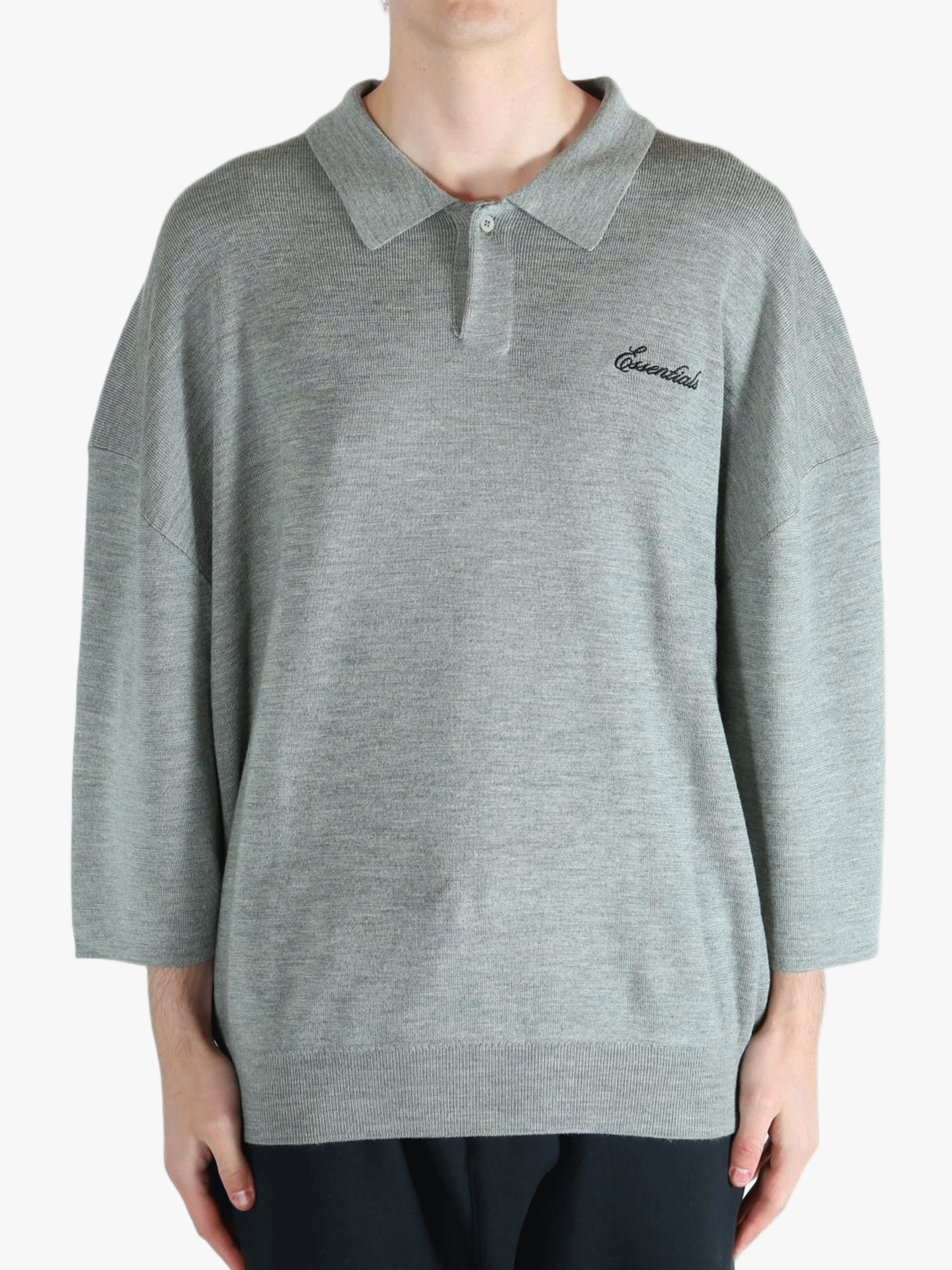 Grey shirt worn by a person, showing the shirt's fit