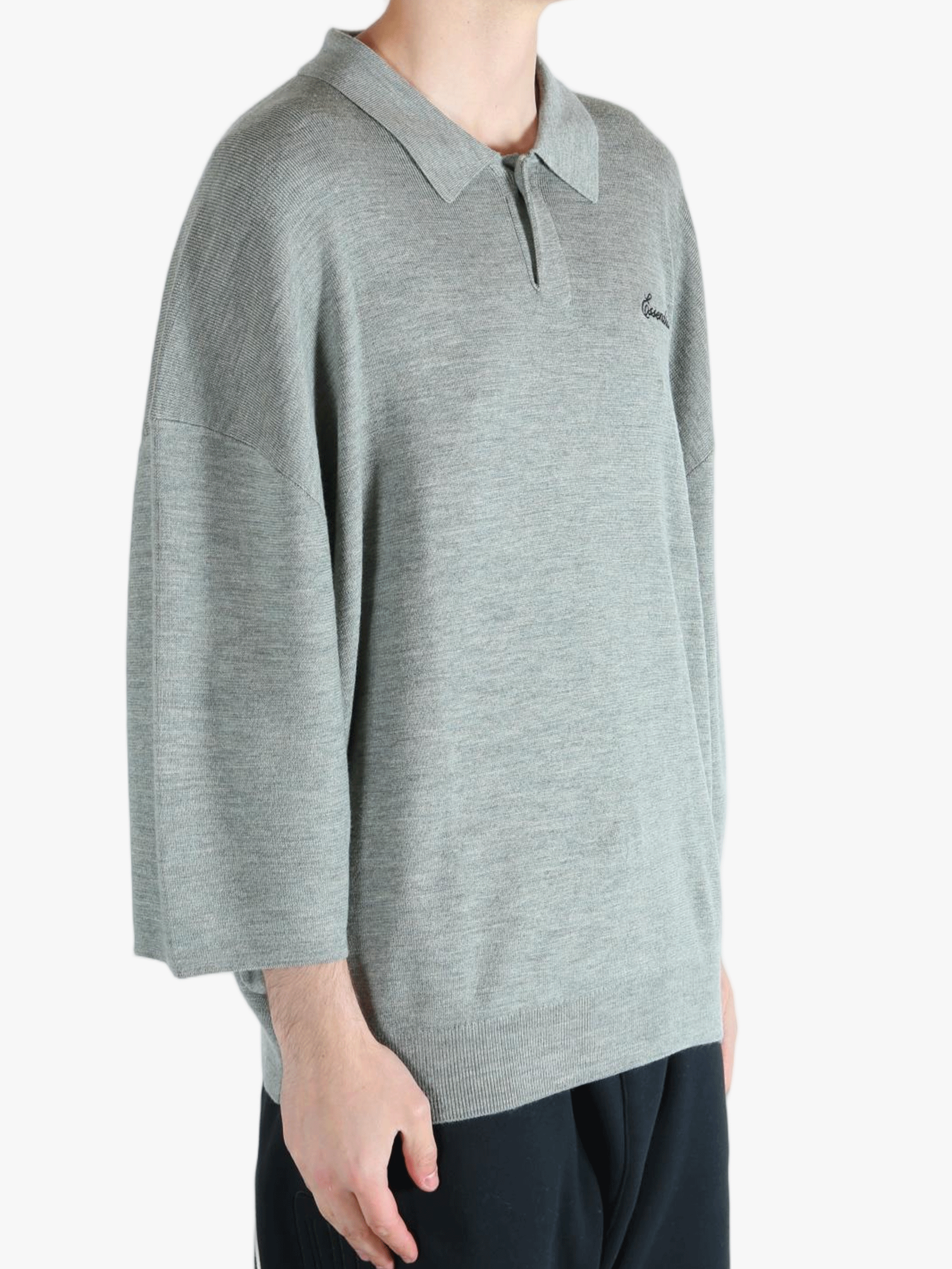 Grey shirt worn by a person, showing the shirt's fit