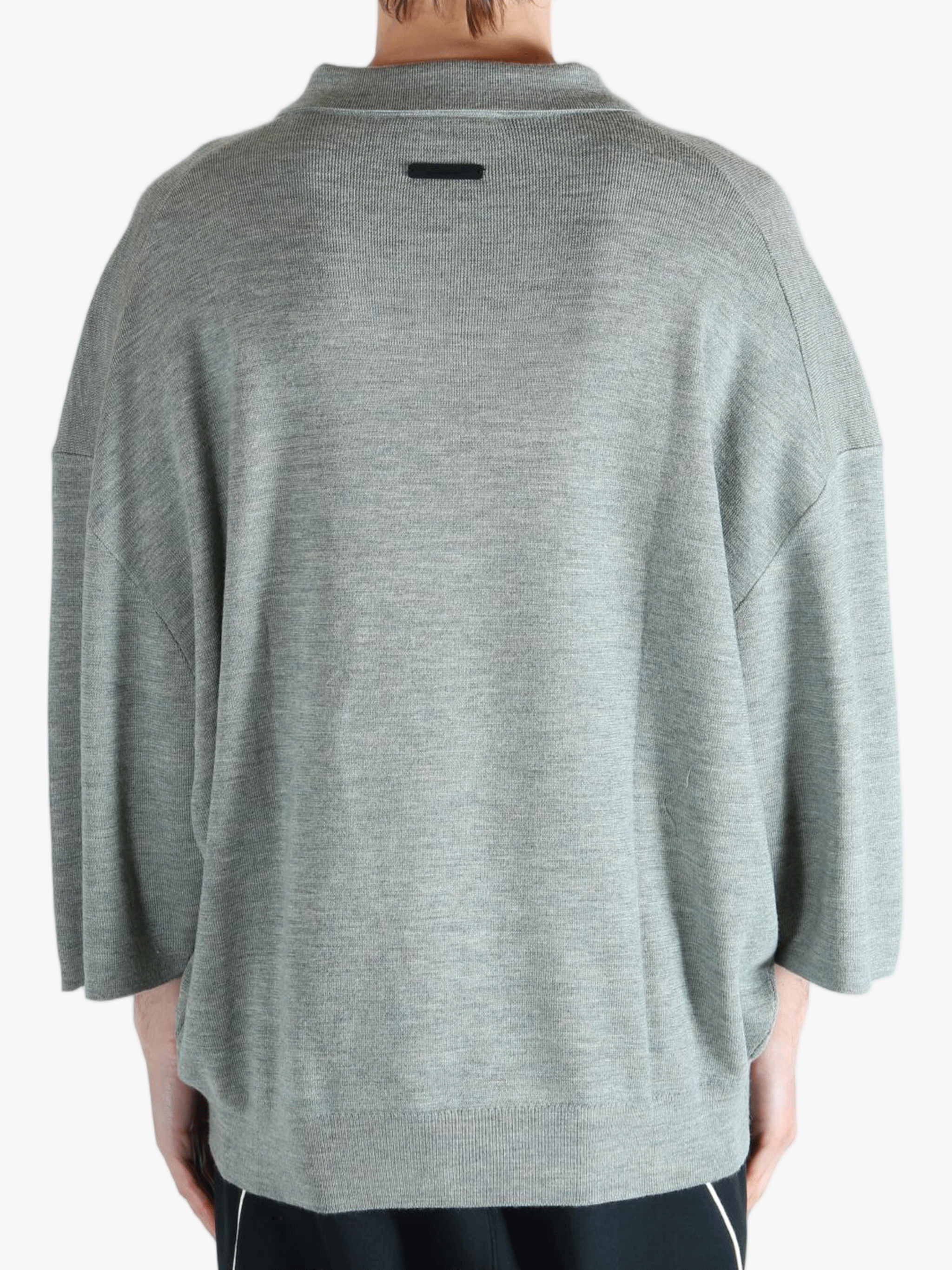 Grey shirt worn by a person, showing the shirt's fit