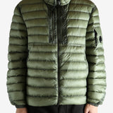 Green jacket worn by a person, showing the jacket's fit