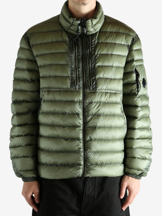 Green jacket worn by a person, showing the jacket's fit