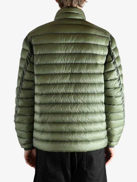 Green jacket worn by a person, showing the jacket's fit