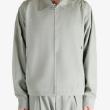 Grey jacket worn by a person, showing the jacket's fit