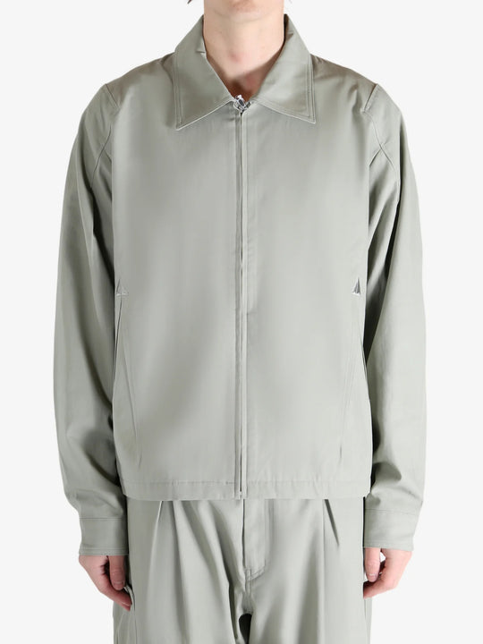 Grey jacket worn by a person, showing the jacket's fit