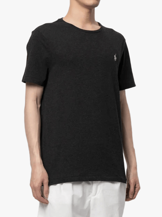 black t-shirt worn by a person, showing the t-shirt fit