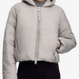 Pink jacket worn by a person, showing the shirt's fit