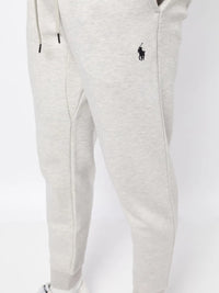 Close up of the grey pants, showing texture of the cotton and polyester fabric