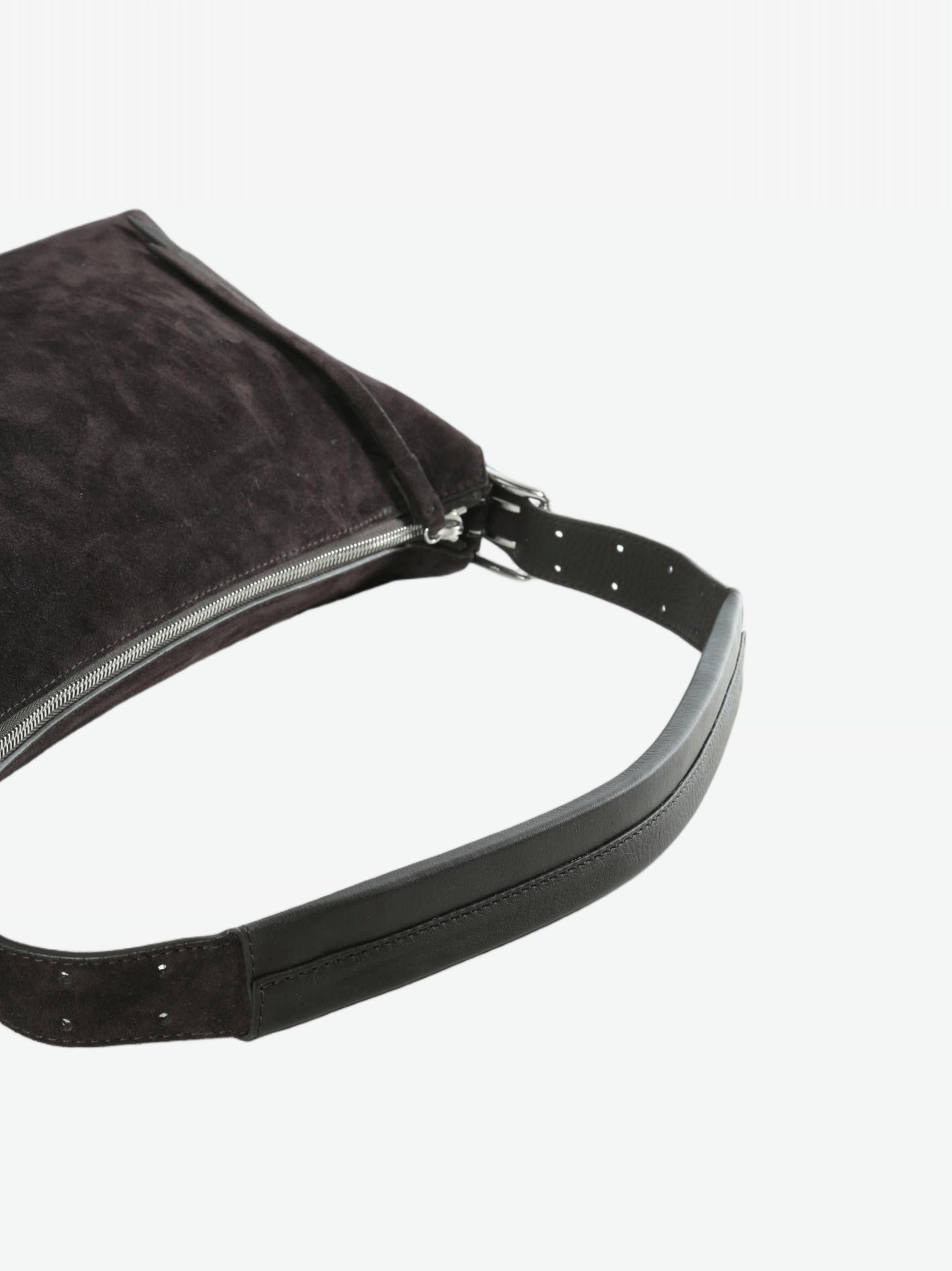 Cloes-up of brown bag, showing texture of the leather fabric