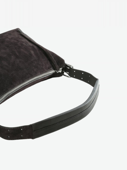 Cloes-up of brown bag, showing texture of the leather fabric