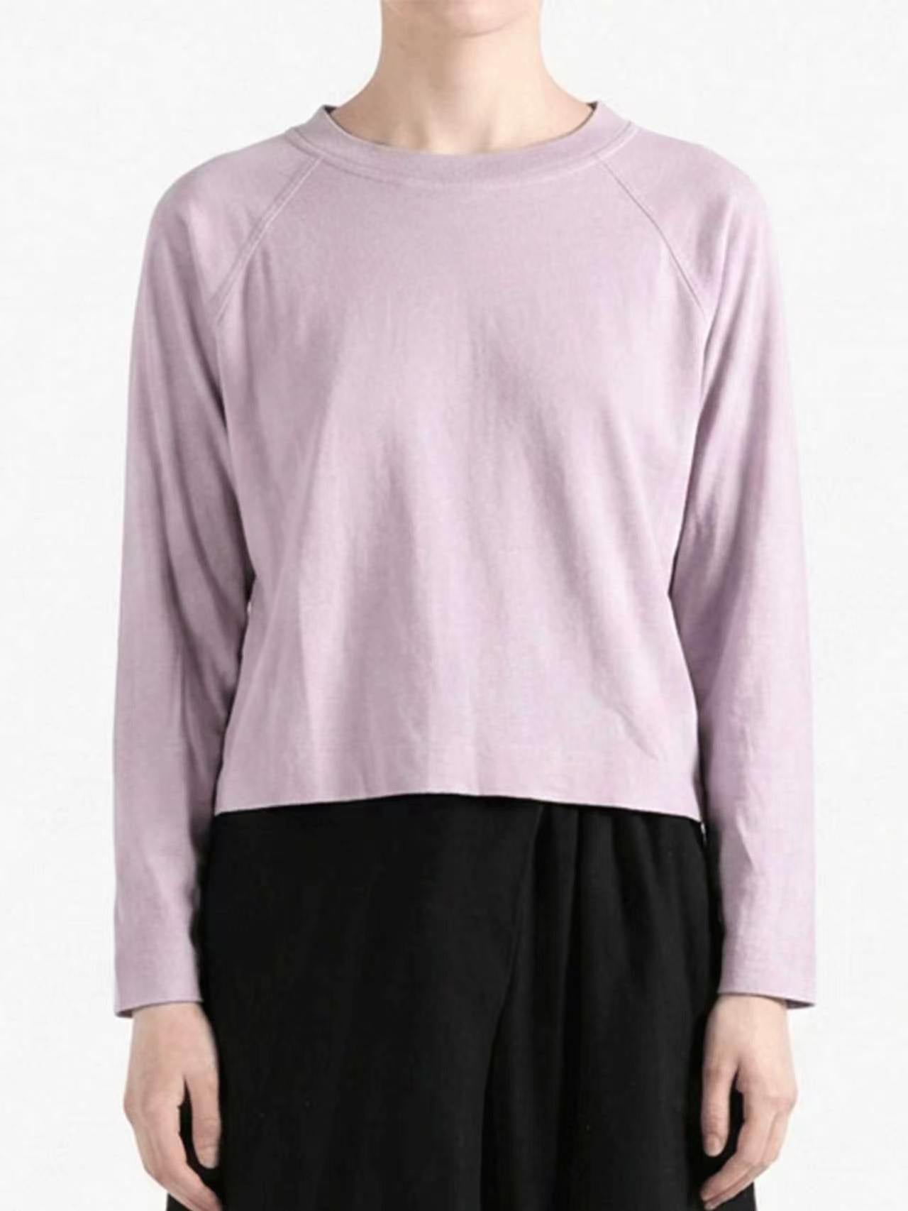 Purple top worn by a person, showing the top's fit