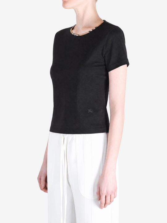  Black shirts worn by a person, showing the shirts fit