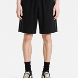 Black shorts worn by a person, showing the shorts fit