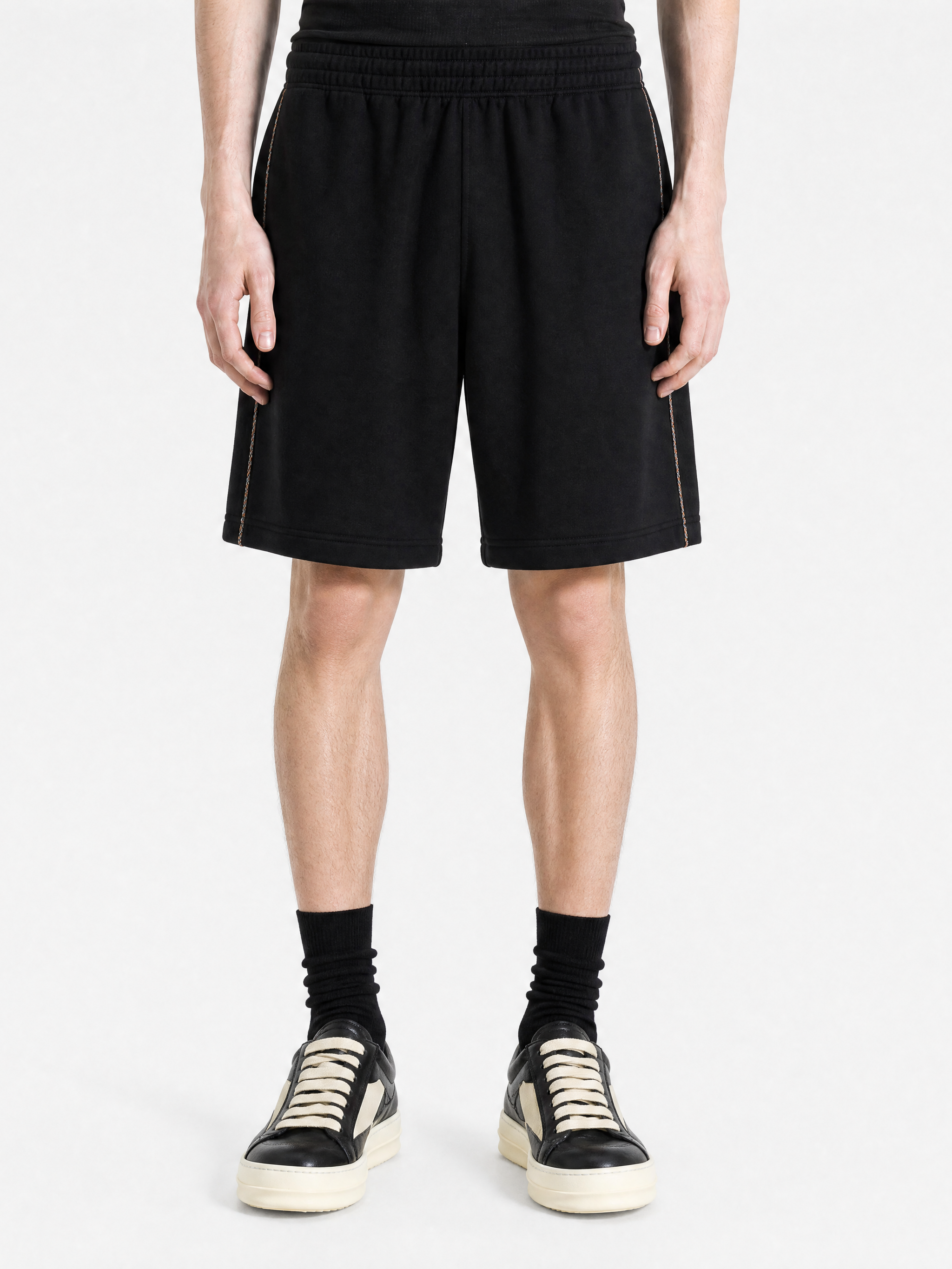 Black shorts worn by a person, showing the shorts fit