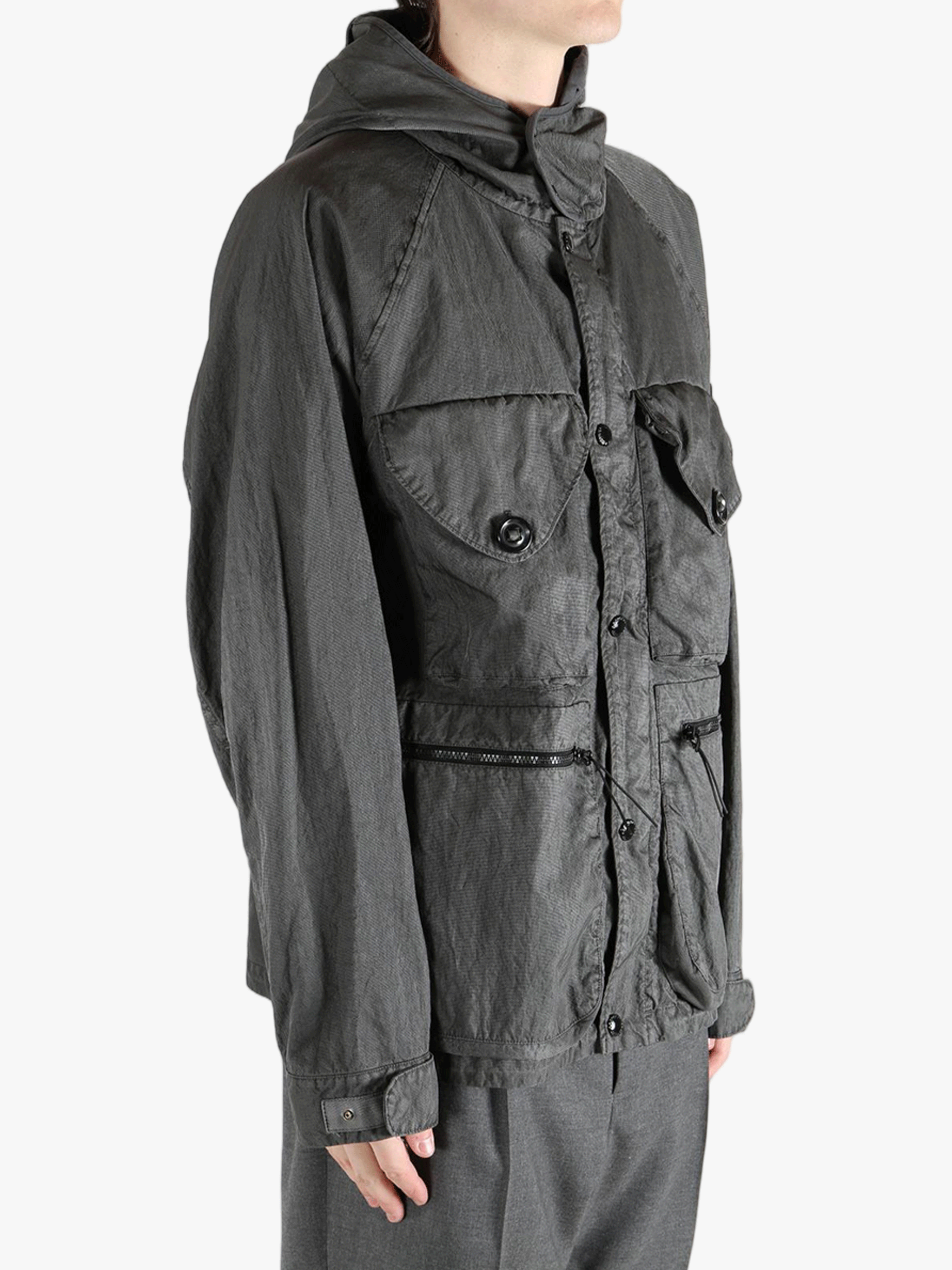 Grey jacket woirn by a person,showing the jacket's fit