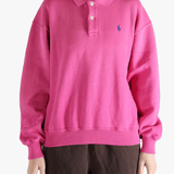 Pink sweatshirt worn by a person, showing the sweatshirt's fit