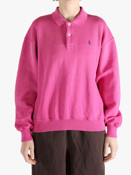 Pink sweatshirt worn by a person, showing the sweatshirt's fit