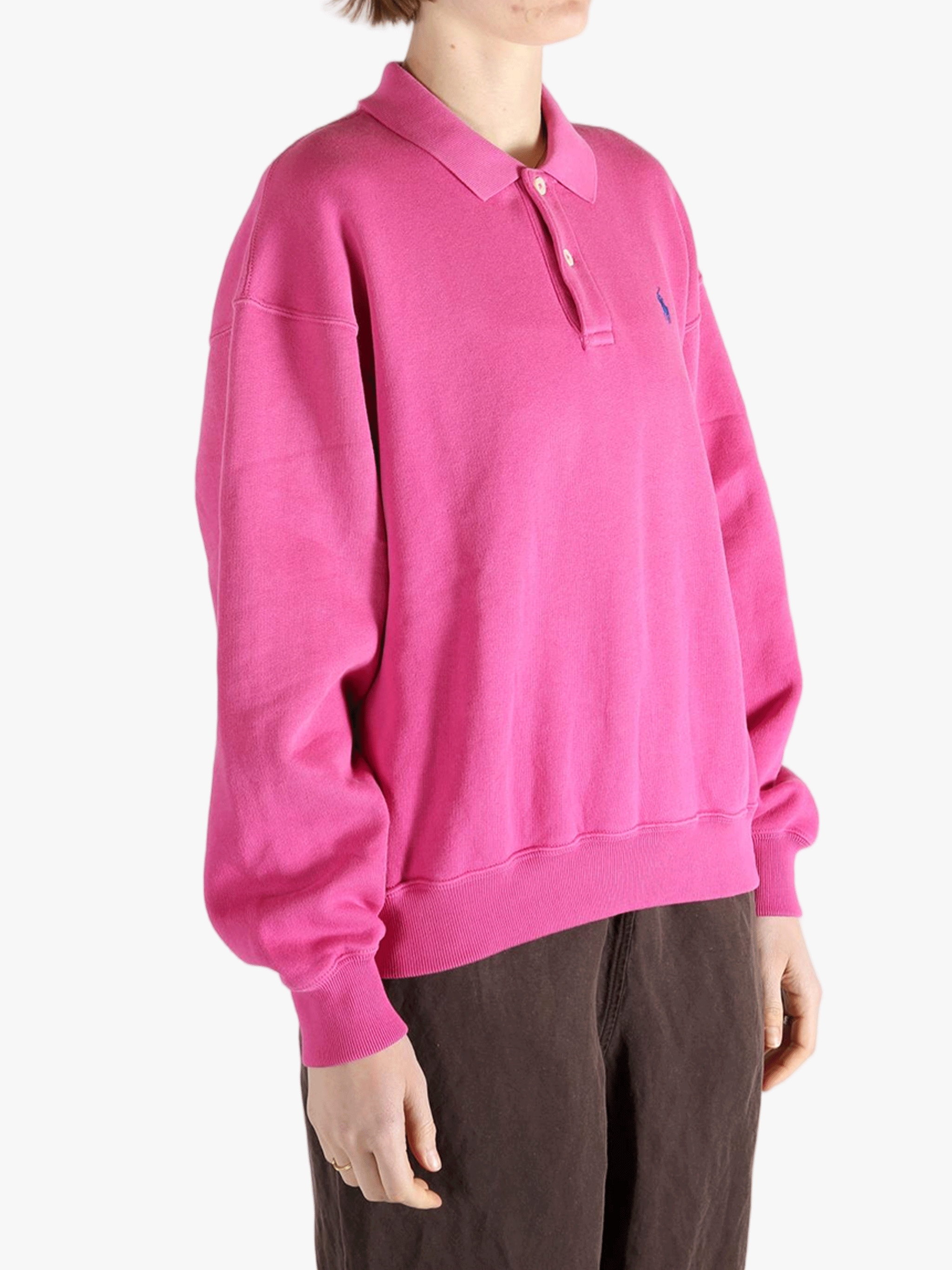 Pink sweatshirt worn by a person, showing the sweatshirt's fit