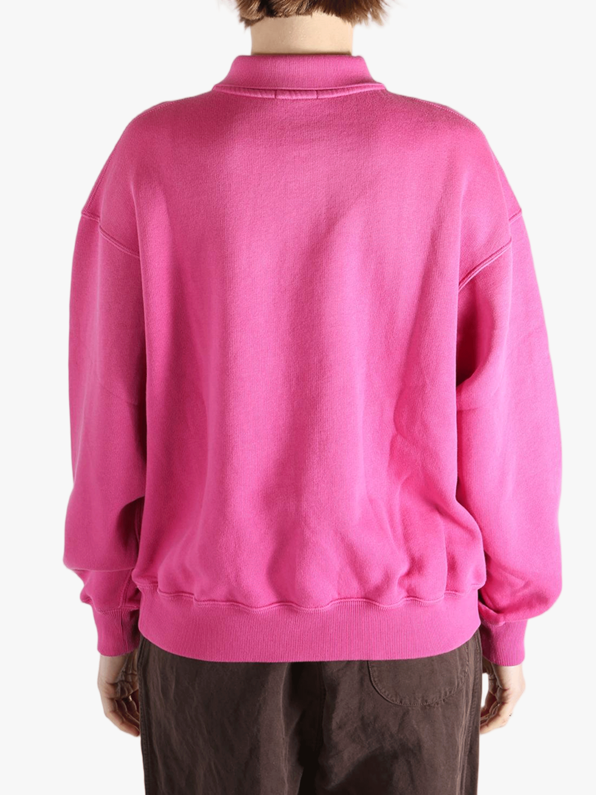 Pink sweatshirt worn by a person, showing the sweatshirt's fit