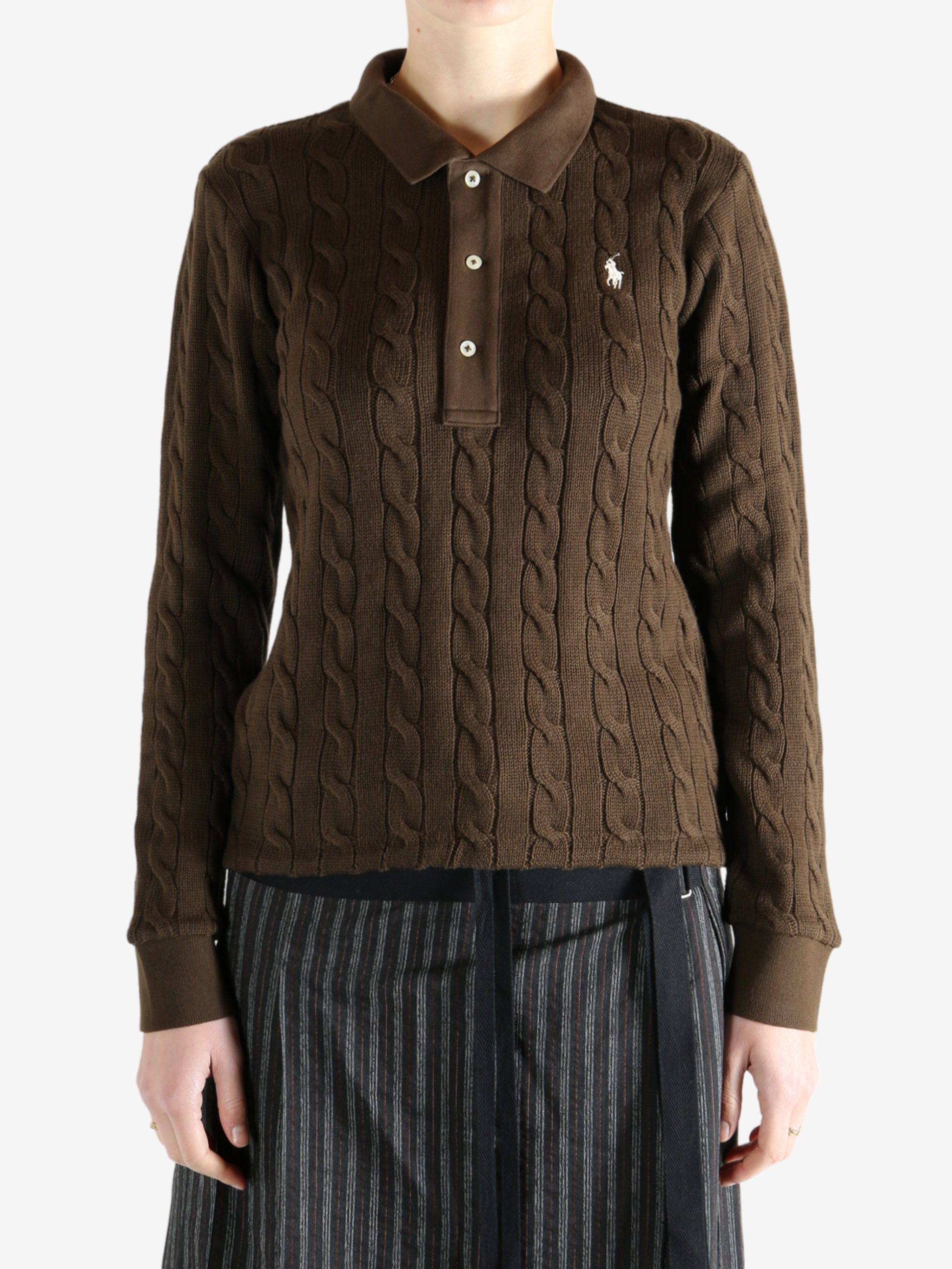 Brown sweater worn by a person, showing the sweater fit
