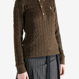 Brown sweater worn by a person, showing the sweater fit