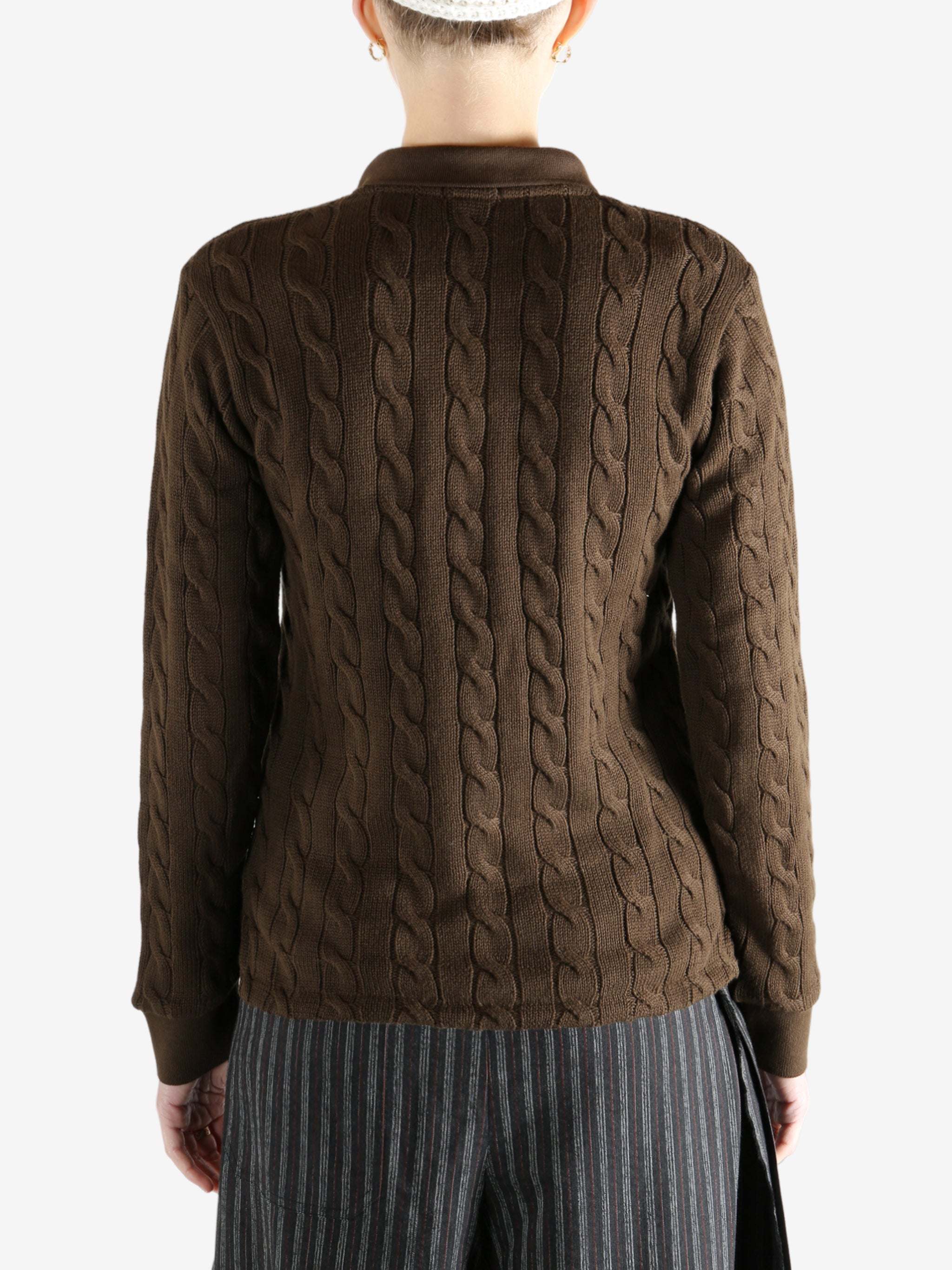 Brown sweater worn by a person, showing the sweater fit