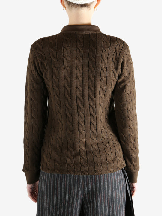 Brown sweater worn by a person, showing the sweater fit