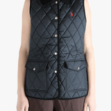 Black coat worn by a person, showing the coat's fit