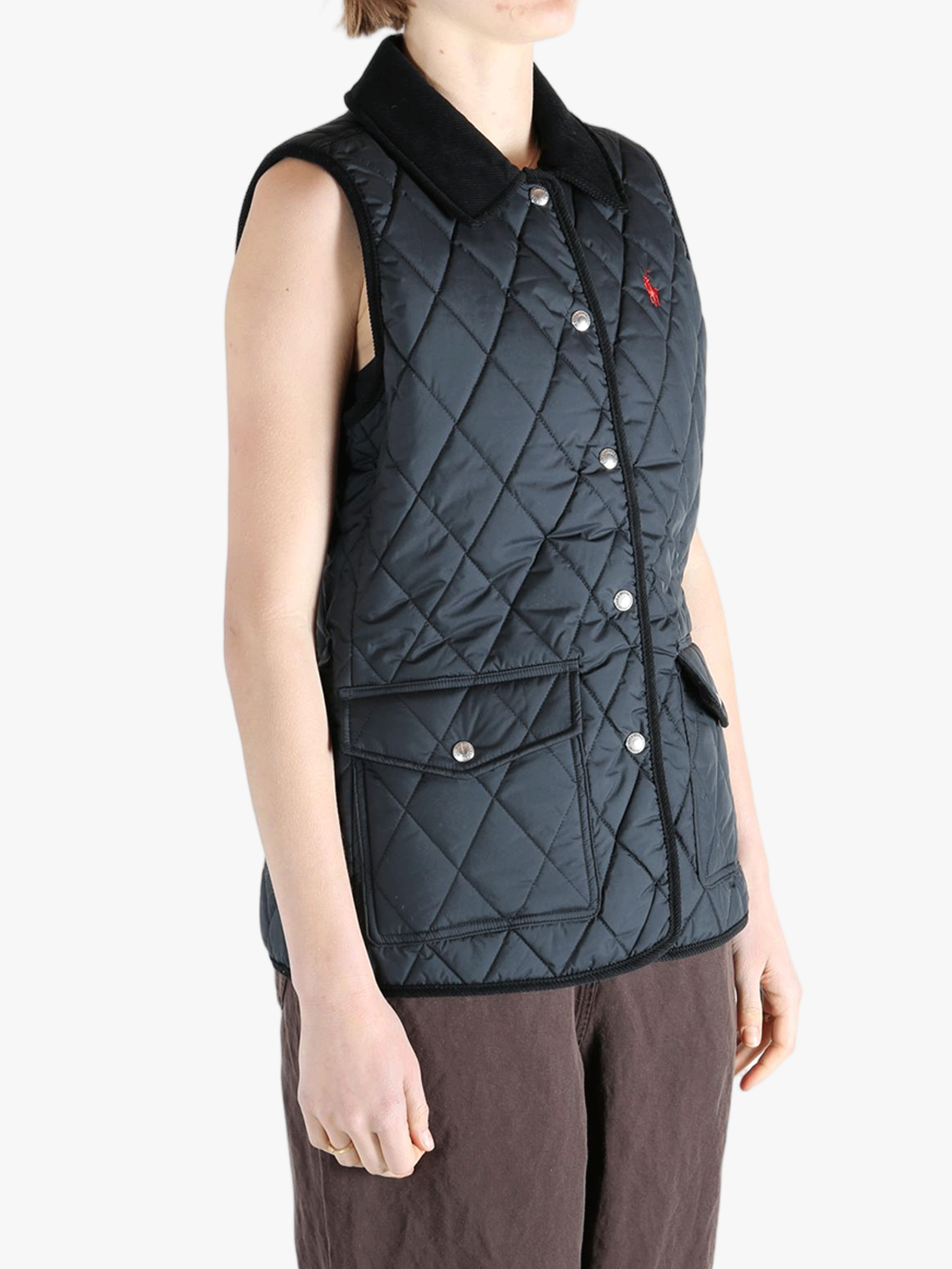 Black coat worn by a person, showing the coat's fit