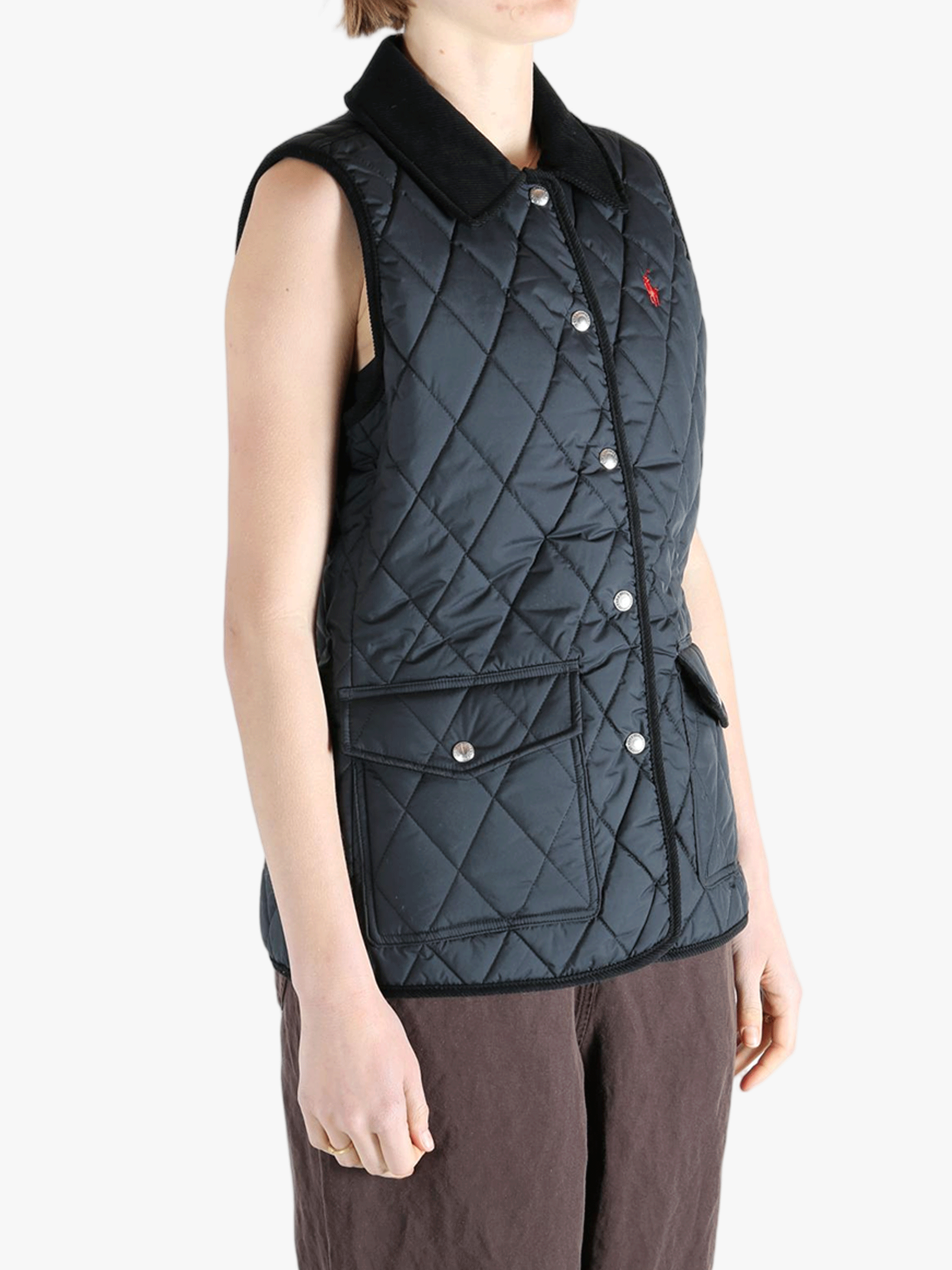 Black coat worn by a person, showing the coat's fit