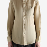 Beige shirt worn by a person, showing the shirt fit