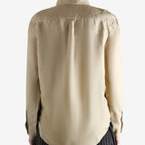 Beige shirt worn by a person, showing the shirt fit