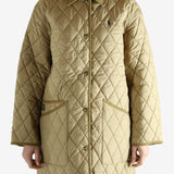 tan sweater worn by a person, showing the sweater fit