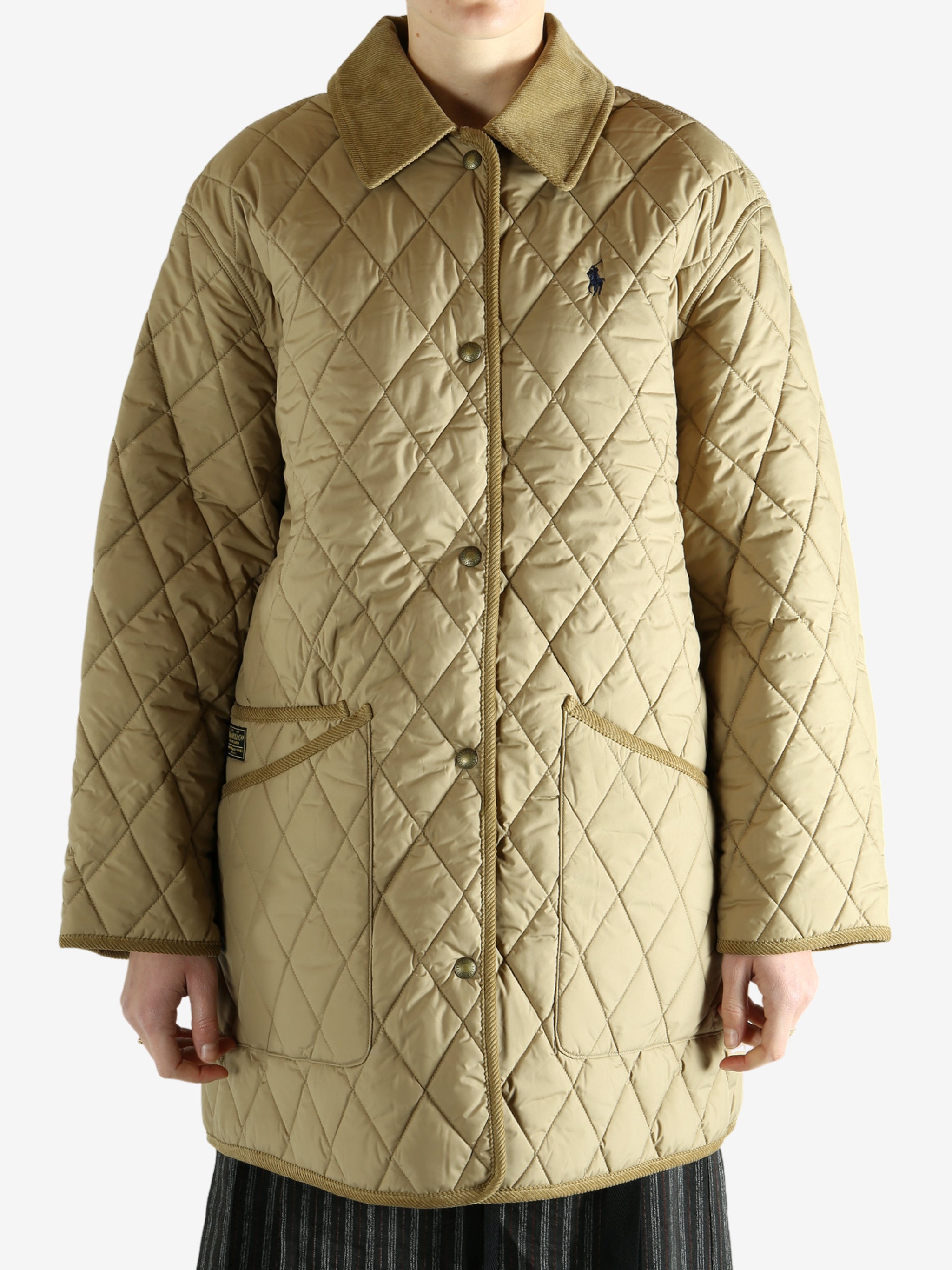 tan sweater worn by a person, showing the sweater fit