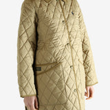 tan sweater worn by a person, showing the sweater fit