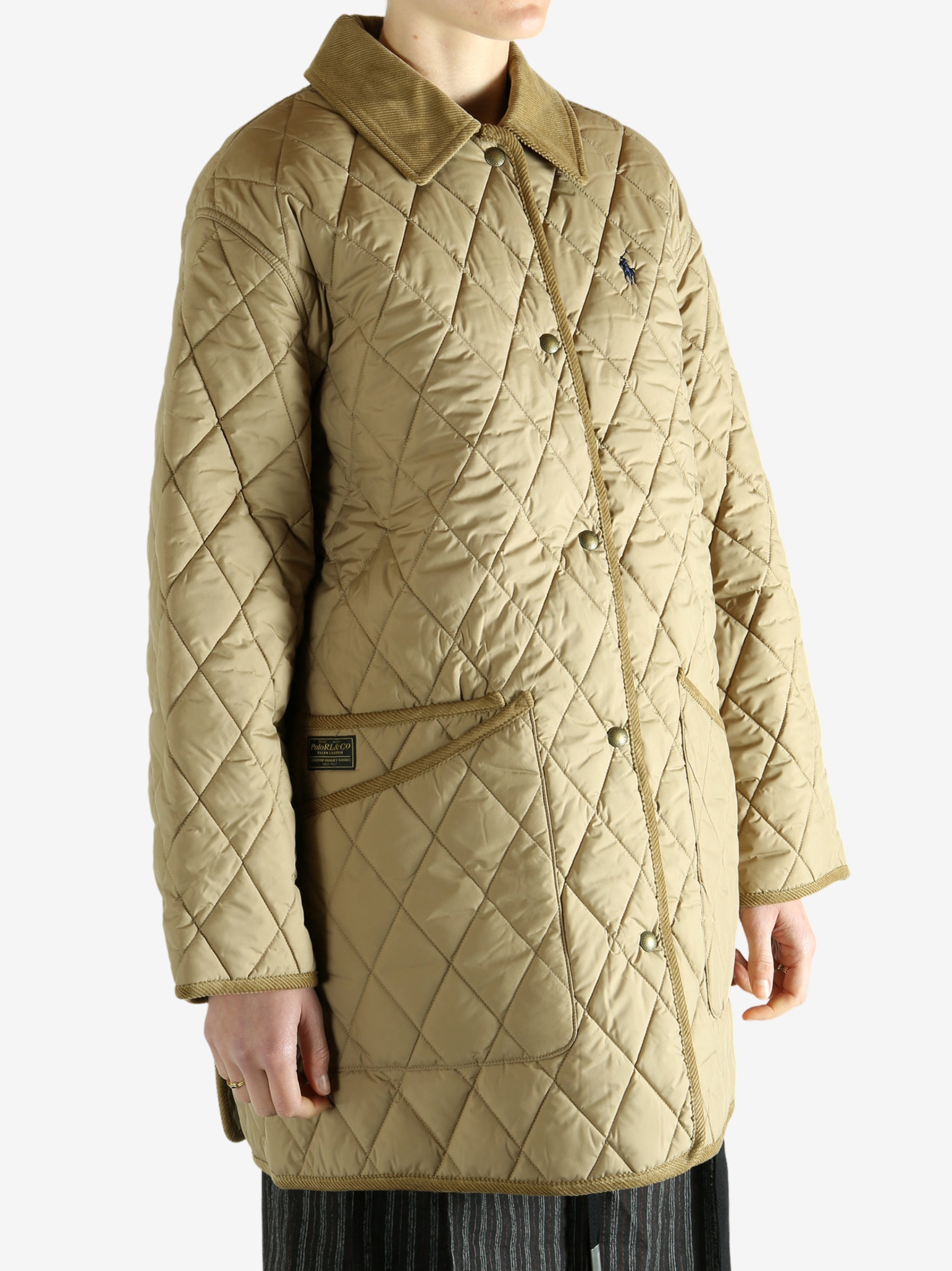 tan sweater worn by a person, showing the sweater fit