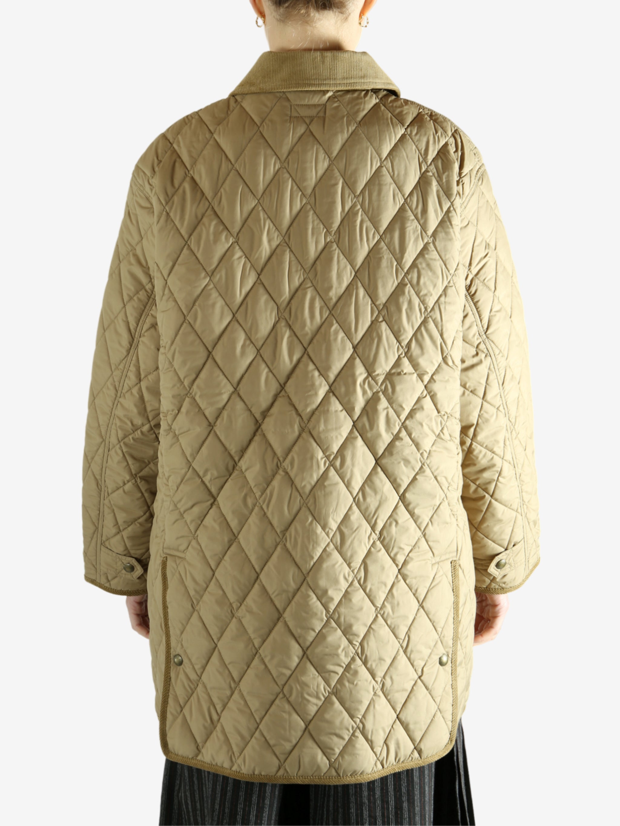 tan sweater worn by a person, showing the sweater fit