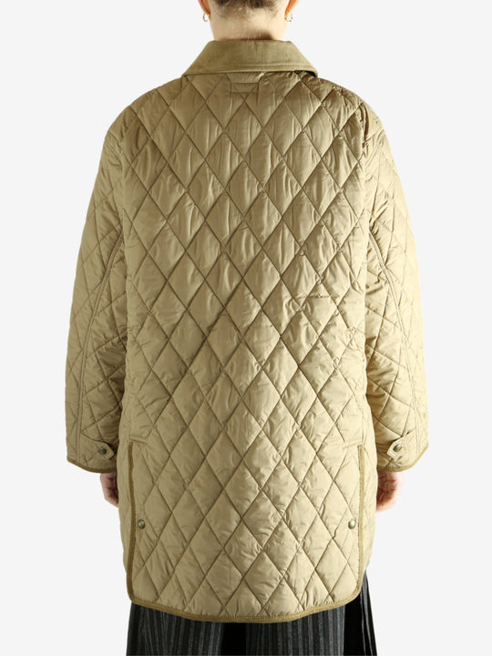 tan sweater worn by a person, showing the sweater fit