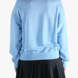 Blue hoodie  worn by a person, showing the hoodie 's fit