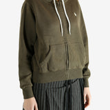 Bronw hoodie worn by a person, showing the hoodie's fit