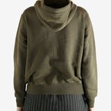 Bronw hoodie worn by a person, showing the hoodie's fit