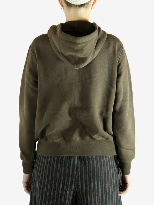 Bronw hoodie worn by a person, showing the hoodie's fit