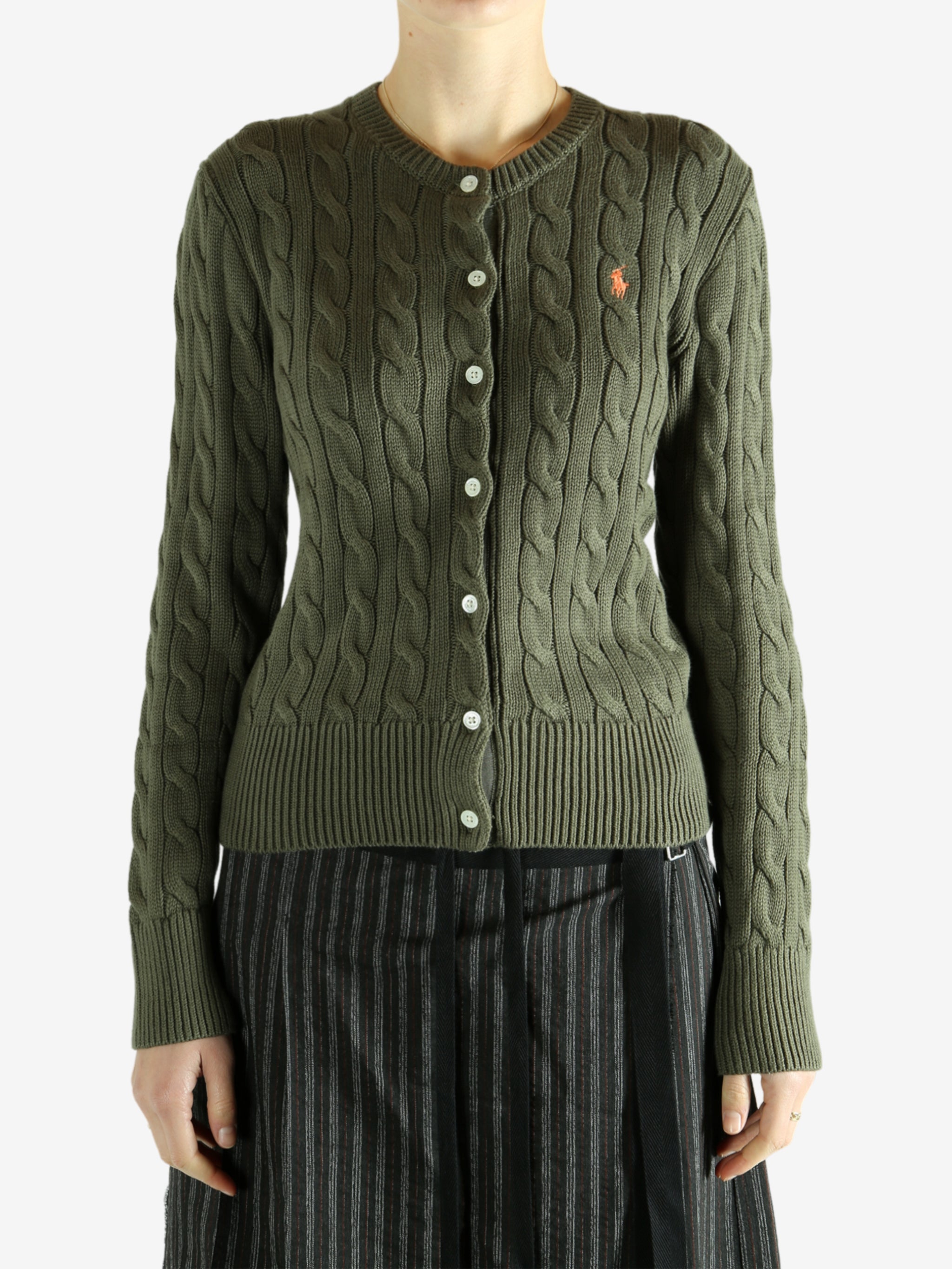 Green cardigan worn by a person, showing the cardigan's fit