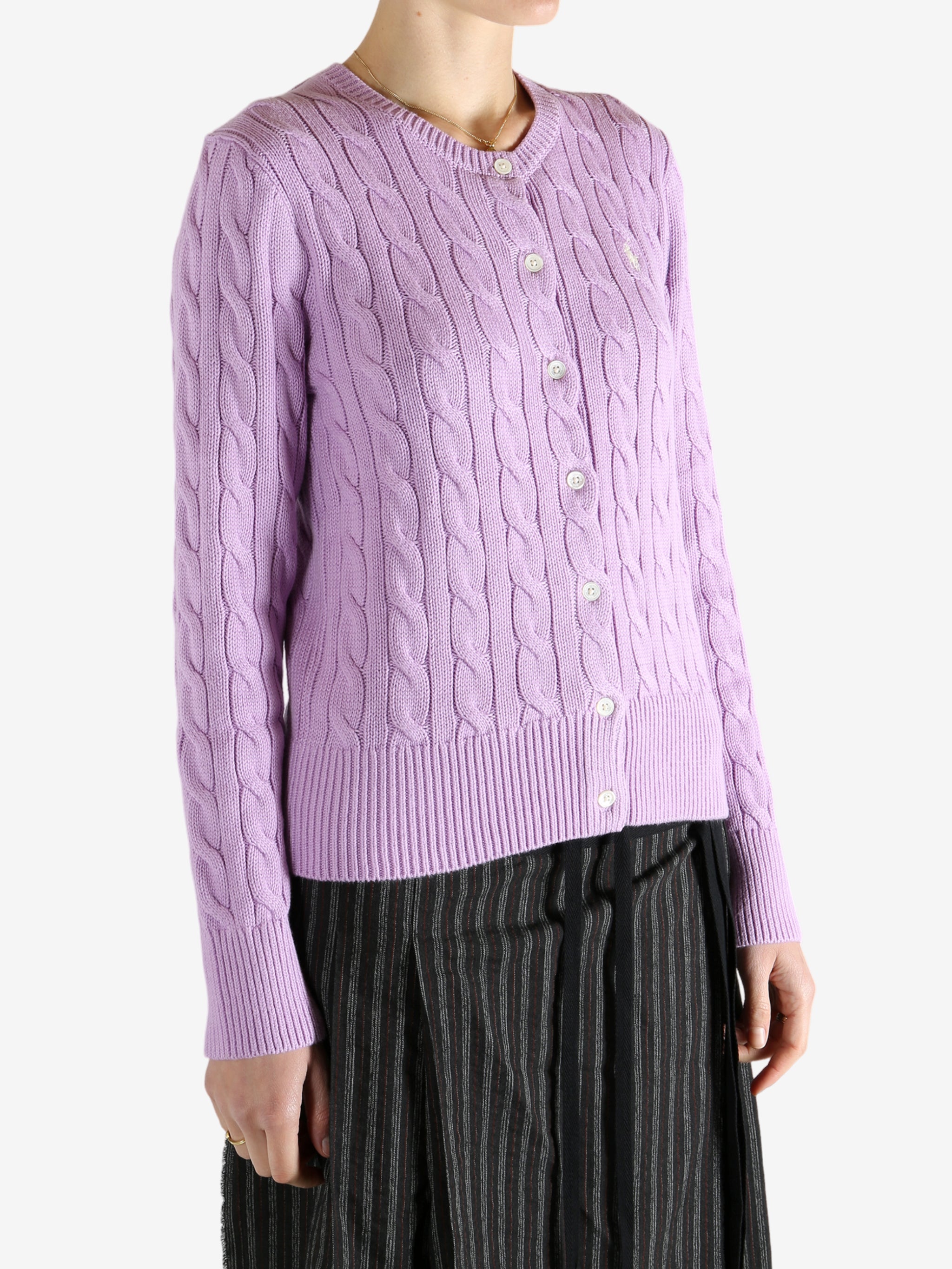 Purple cardigan worn by a person, showing the cardigan's fit