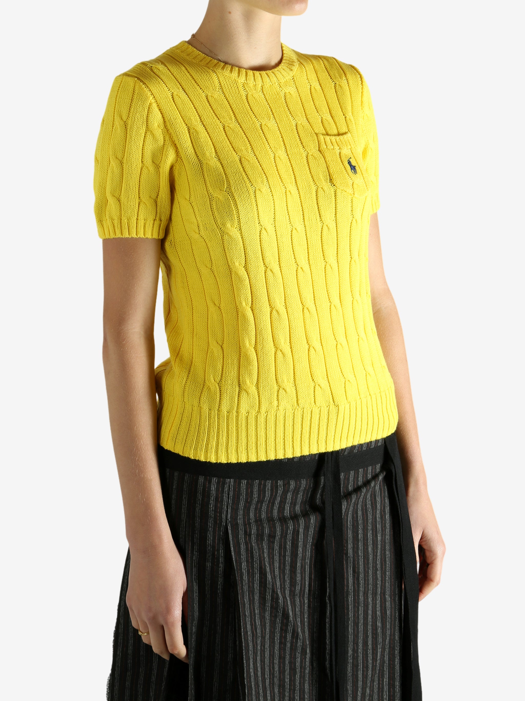 yellow sweater worn by a person, showing the sweater fit