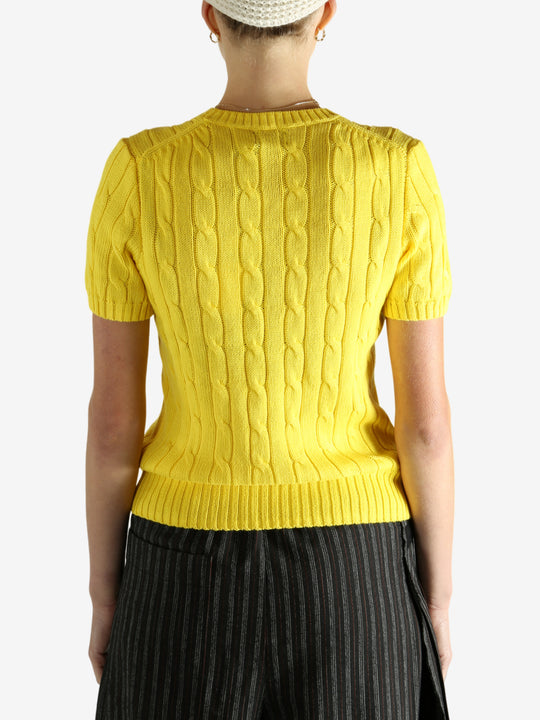 yellow sweater worn by a person, showing the sweater fit