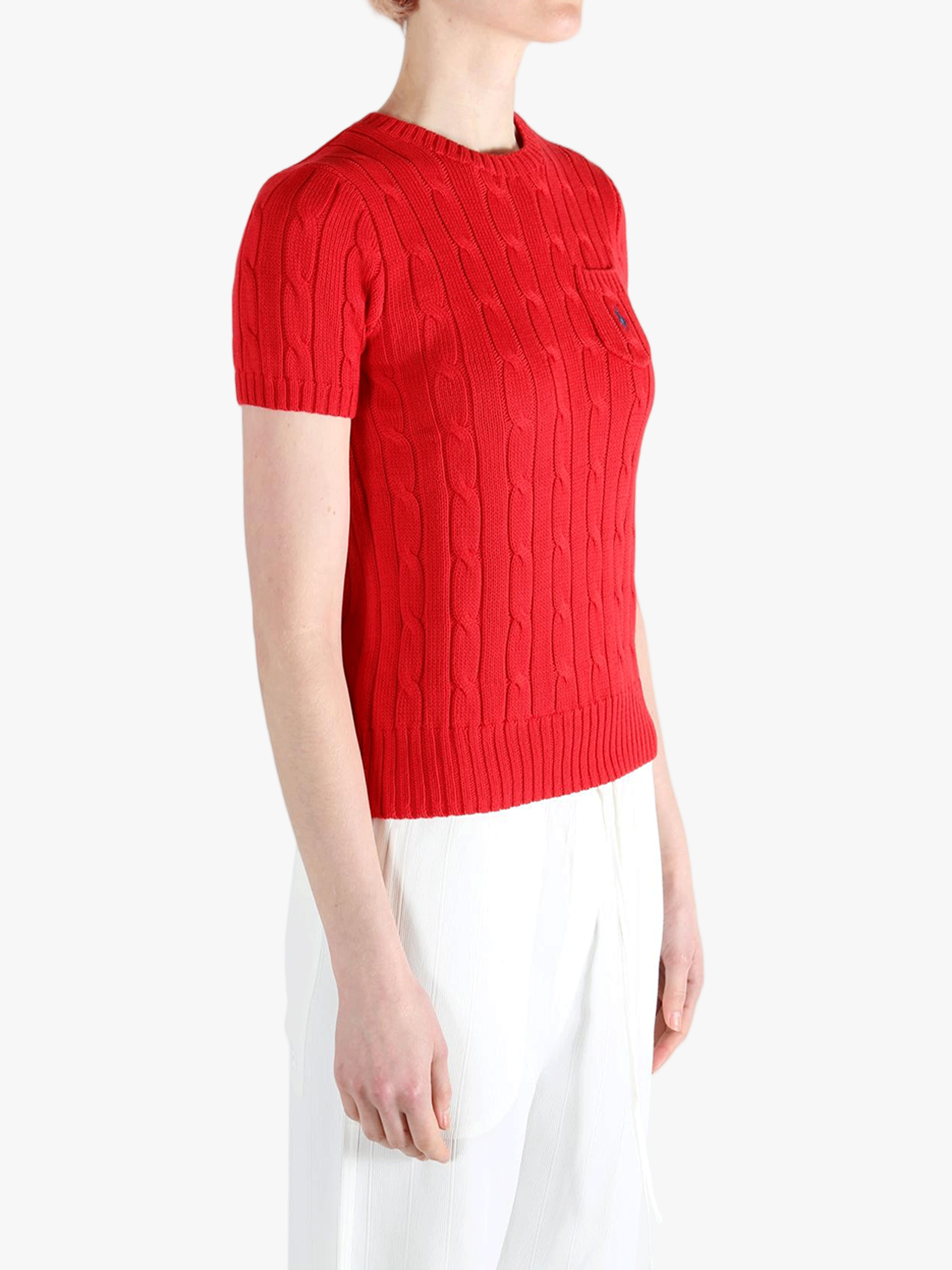 Red knitwear worn by a person, showing knitwear's fit