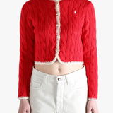 Red knitwear worn by a person, showing the knitwear fit