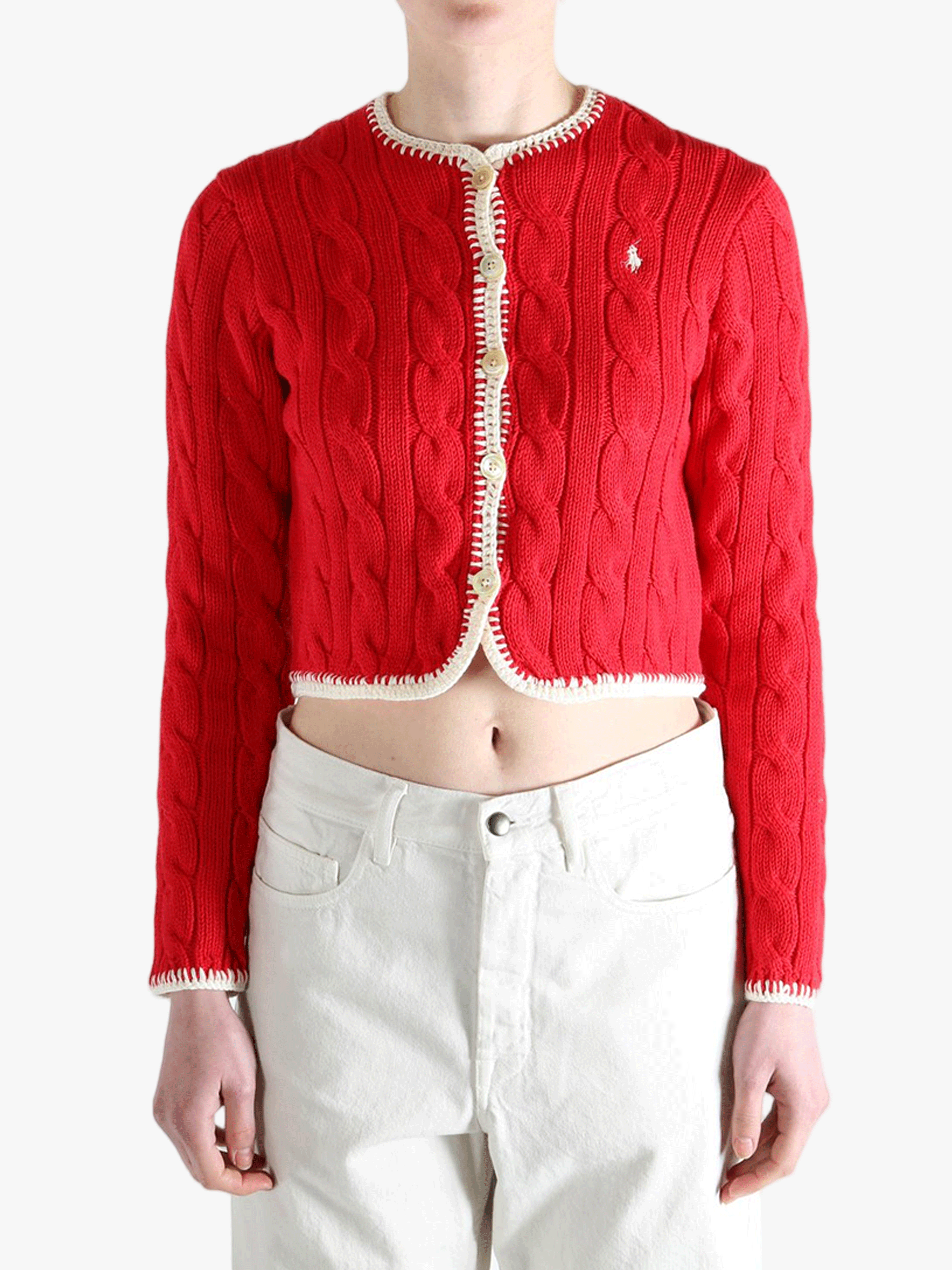 Red knitwear worn by a person, showing the knitwear fit